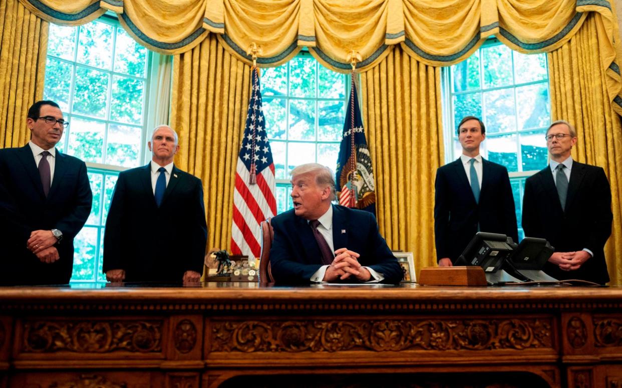 US President Donald Trump in the White House, where the historic deal will be signed on Tuesday - AFP