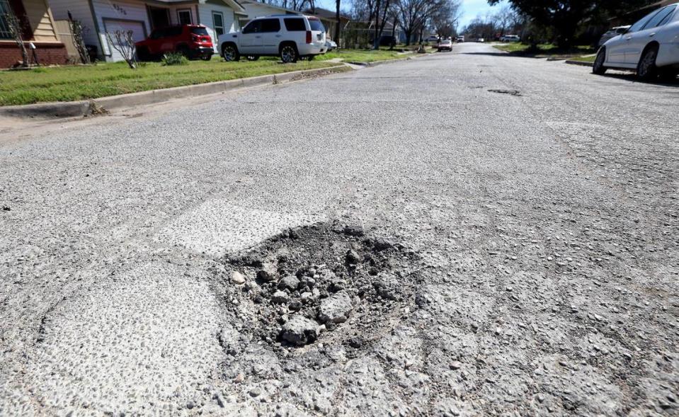 A pothole on South Adams Street near West Berry Street on Tuesday, February 21, 2024.