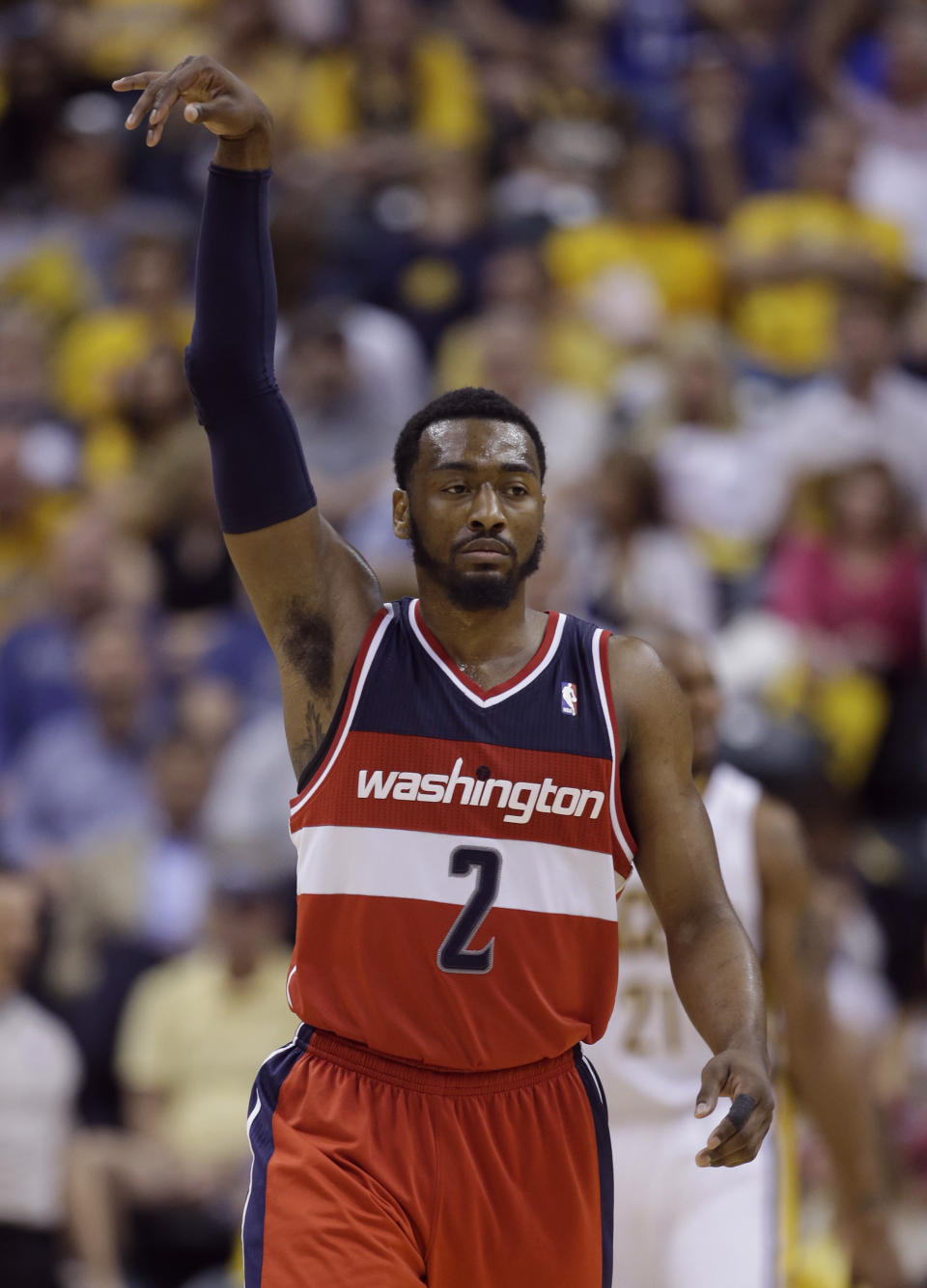 Washington Wizards guard John Wall signals after hitting a three-point basket against the Indiana Pacers during the second half of game 5 of the Eastern Conference semifinal NBA basketball playoff series Tuesday, May 13, 2014, in Indianapolis. (AP Photo/Darron Cummings)