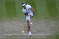 Spain's Rafael Nadal serves to Botic Van De Zandschulp of the Netherlands in a men's singles fourth round match on day eight of the Wimbledon tennis championships in London, Monday, July 4, 2022. (AP Photo/Alastair Grant)