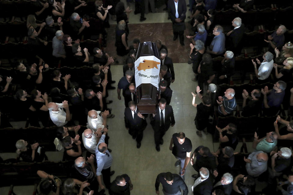 Pallbearers carry the coffin of the former Cyprus' President Dimitris Christofias during his state funeral at the Orthodox Christian Church of the Lord's Wisdom in capital Nicosia, Cyprus, Tuesday, June 25, 2019. European communist and left-wing party heads and leaders from ethnically split Cyprus' breakaway Turkish Cypriot community were among those attending a funeral service for the country's former president Christofias. (AP Photo/Petros Karadjias)