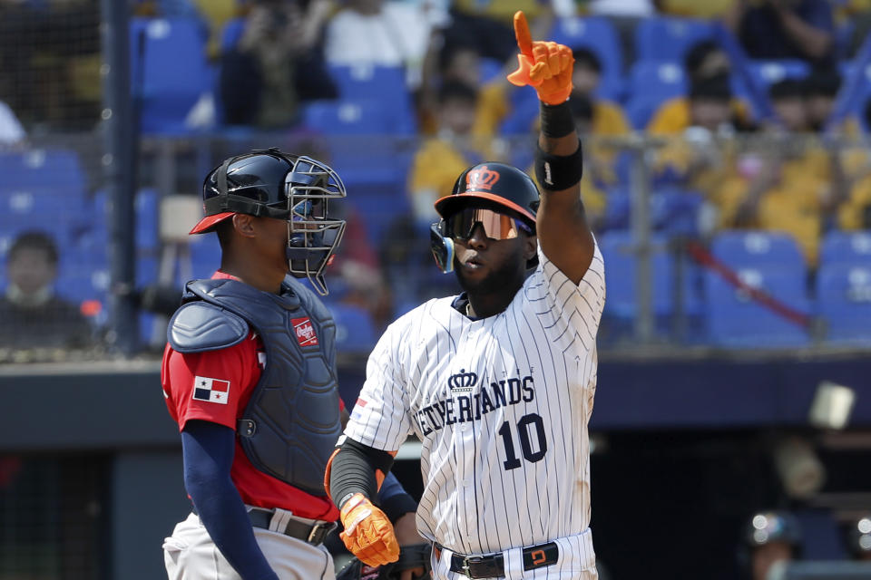 Netherlands batter Jurickson Profar greets to his teammates after hitting a solo home run against Panama during the World Baseball Classic (WBC) at the Taichung Intercontinental Baseball Stadium in Taichung, Taiwan, Thursday, March 9, 2023. (AP Photo/I-Hwa Cheng)