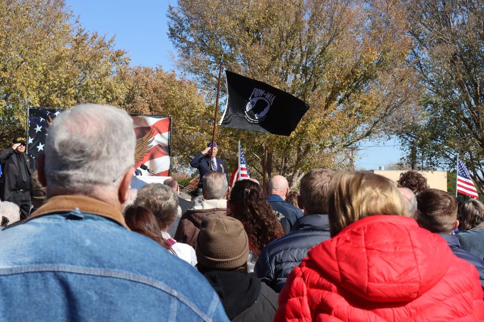 The audience stands to honor the flag of the POW-MIA at the Texas Panhandle War Memorial Center in this November 2023 file photo.