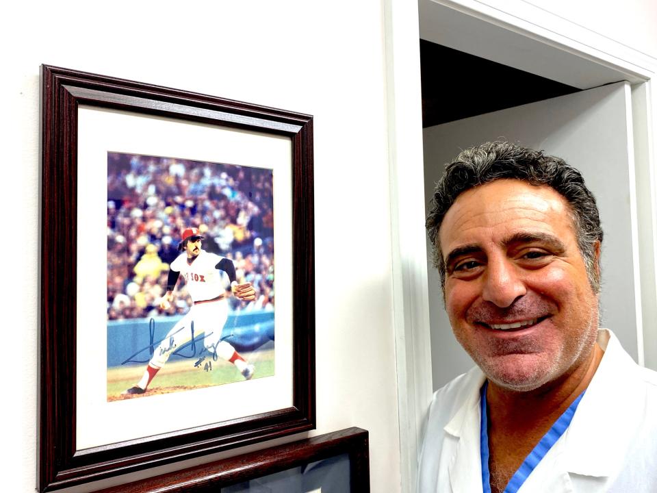 Providence doctor Louis Simeone proudly displays a signed picture of Drago on his office wall.