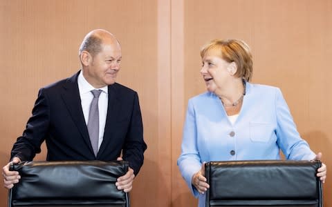 Merkel Scholz - Credit: HAYOUNG JEON/EPA-EFE/REX