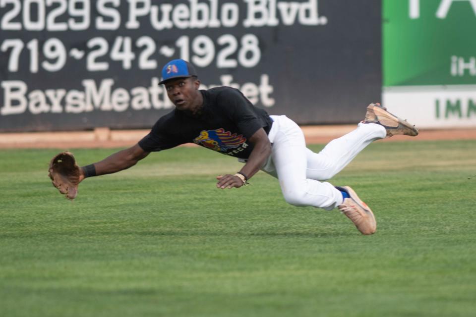 Pueblo Azteca outfielder Braxton Vail dives in attempt to catch a fly ball during a game against the Woodward Travelers during the 42nd annual Tony Andenucio Memorial Baseball Tournament on Saturday, June 18, 2022, in Pueblo, Colo.