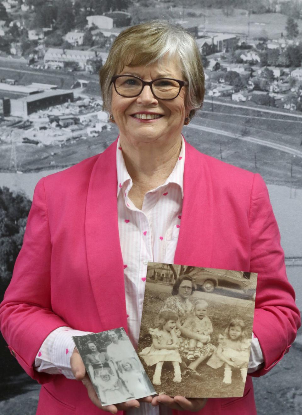 Alice Walker holds a couple of family photographs inside the Cramerton Historical Museum Monday morning, April 22, 2024.