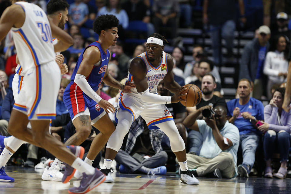 Oct 19, 2023; Tulsa, Oklahoma, USA; Oklahoma City Thunder guard Luguentz Dort (5) is guarded against Detroit Pistons guard Killian Hayes (7) in first half at BOK Center. Mandatory Credit: Joey Johnson-USA TODAY Sports