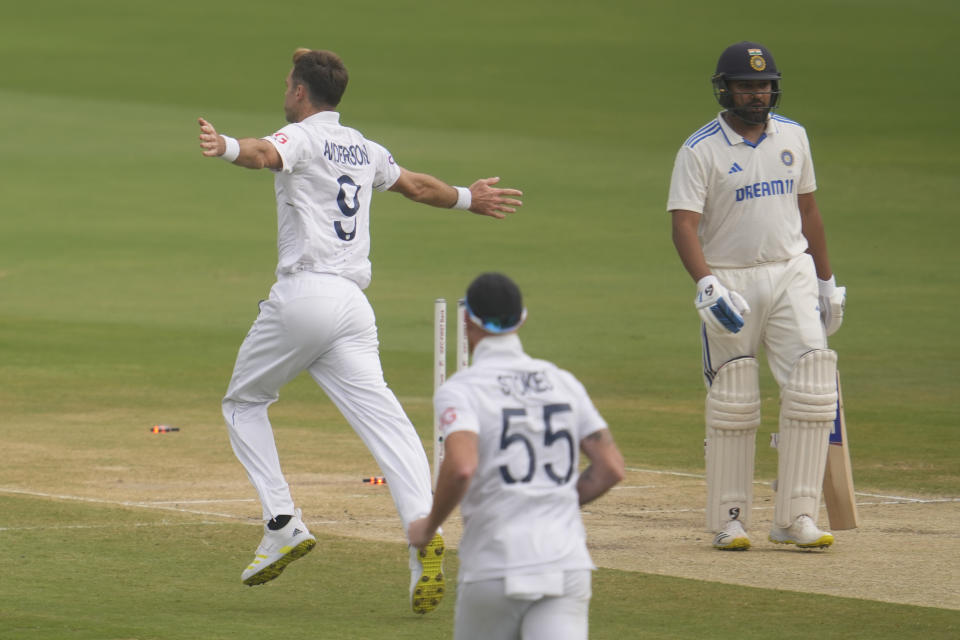 England's James Anderson celebrates the wicket of India's captain Rohit Sharma, right, on the third day of the second test match between India and England, in Visakhapatnam, India, Sunday, Feb. 4, 2024. (AP Photo/Manish Swarup)
