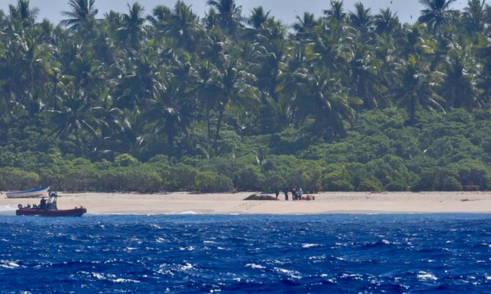 Their boat was damaged, the Coast Guard said, leaving them stranded on the island. U.S. Coast Guard