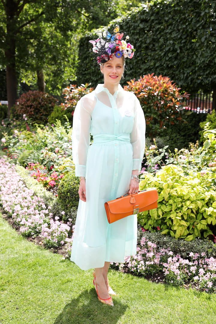 One guest opted for a sheer shirt dress in pistachio with a lovely floral headpiece to finish. [Photo: Getty]