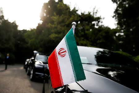 FILE PHOTO: Cars of the Iranian delegation are seen parked outside a building of the Diaoyutai state guesthouse as Iranian Foreign Minister Mohammad Javad Zarif meets Chinese State Councillor and Foreign Minister Wang Yi in Beijing, China, May 13, 2018. REUTERS/Thomas Peter/File Photo