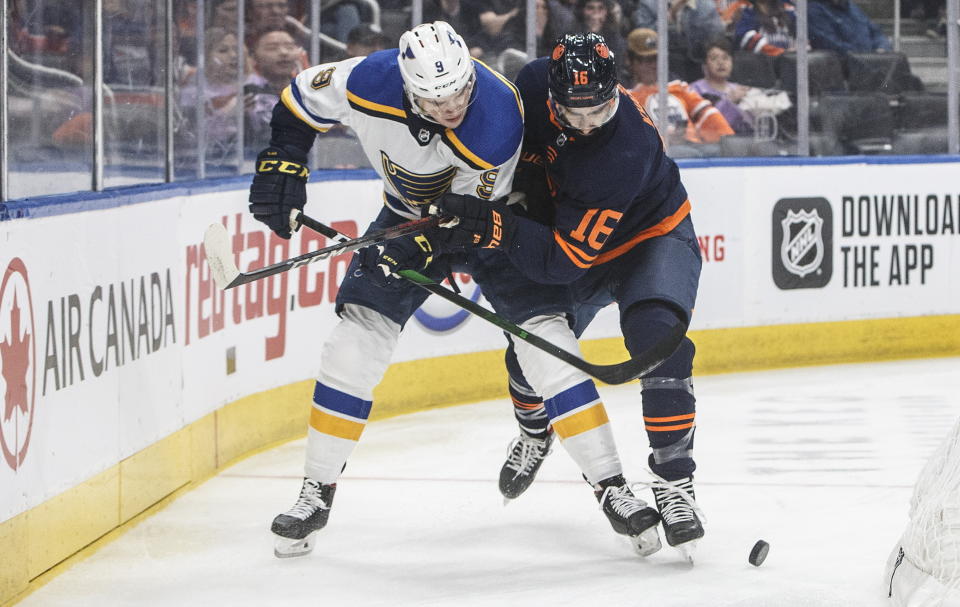 St. Louis Blues' Sammy Blais (9)and Edmonton Oilers' Jujhar Khaira (16) work for the puck during the first period of an NHL hockey game Friday, Jan. 31, 2020, in Edmonton, Alberta. (Jason Franson/The Canadian Press via AP)