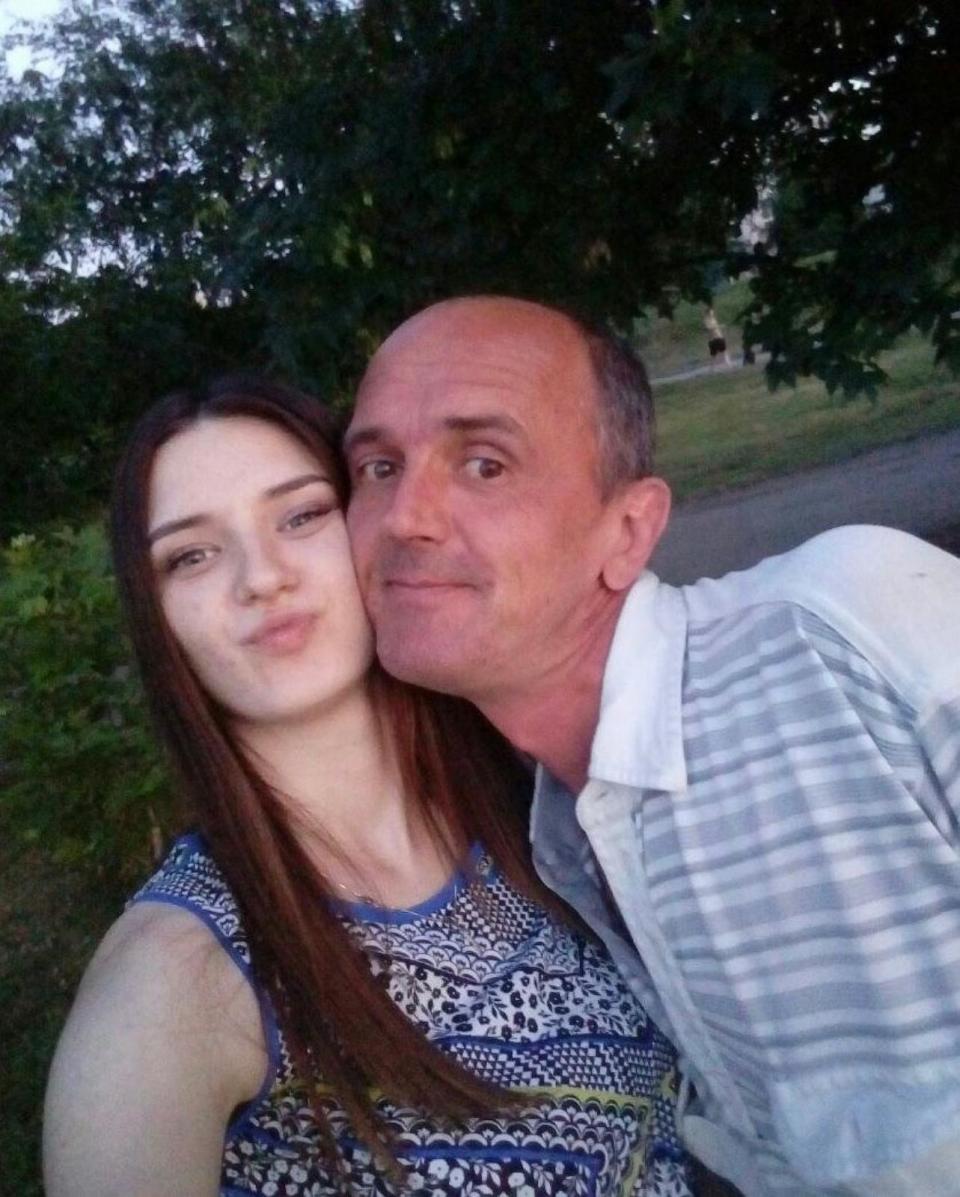 PHOTO: Yulia Khrypun poses in an undated photo with her father, Serhiy, who she says was taken into Russian captivity while working as a security officer at a farm in a village in Ukraine's Zaporizhzhia region.  (Yulia Khrypun)