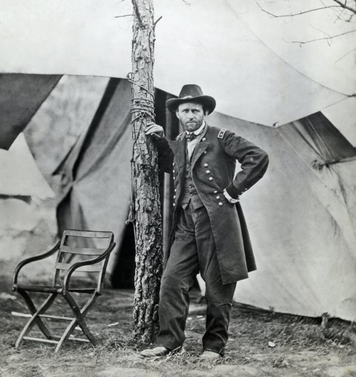 General Grant stands in front of his campaign tent at his headquarters in Virginia in 1865. <a href="https://www.gettyimages.com/detail/news-photo/general-grant-stands-in-front-of-his-campaign-tent-at-his-news-photo/515359842?phrase=ulysses%20s%20grant&adppopup=true" rel="nofollow noopener" target="_blank" data-ylk="slk:Bettmann/Getty Images" class="link ">Bettmann/Getty Images</a>