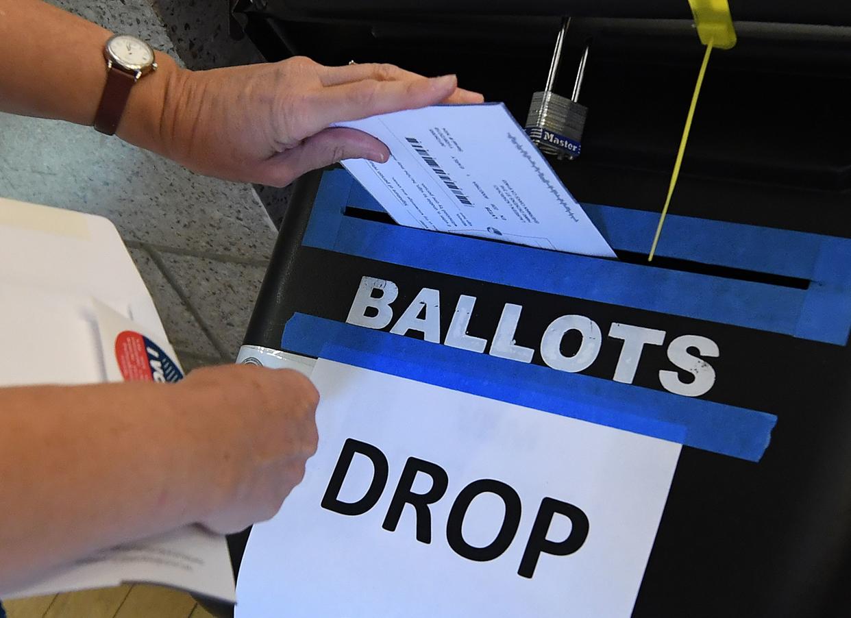 <span class="s1">A woman places her ballot in the box during early voting in Sylmar, Calif., on Saturday. (Photo: Mark Ralston/AFP/Getty Images)</span>