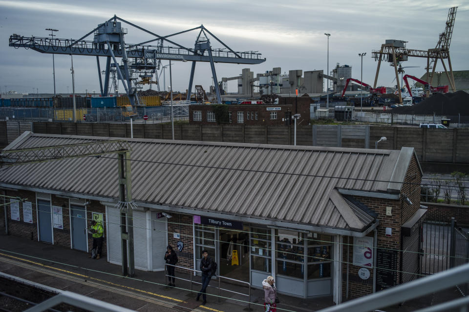 TILBURY, ENGLAND - OCTOBER 28: Passengers wait for a train at Tilbury Town Station next to Tilbury Docks near Purfleet on October 28, 2019 in Tilbury, England. Purfleet port was the arrival point for a lorry trailer with 39 smuggled migrants, all of whom were found dead early on October 23 in the nearby town of Grays. (Photo by Dan Kitwood/Getty Images)