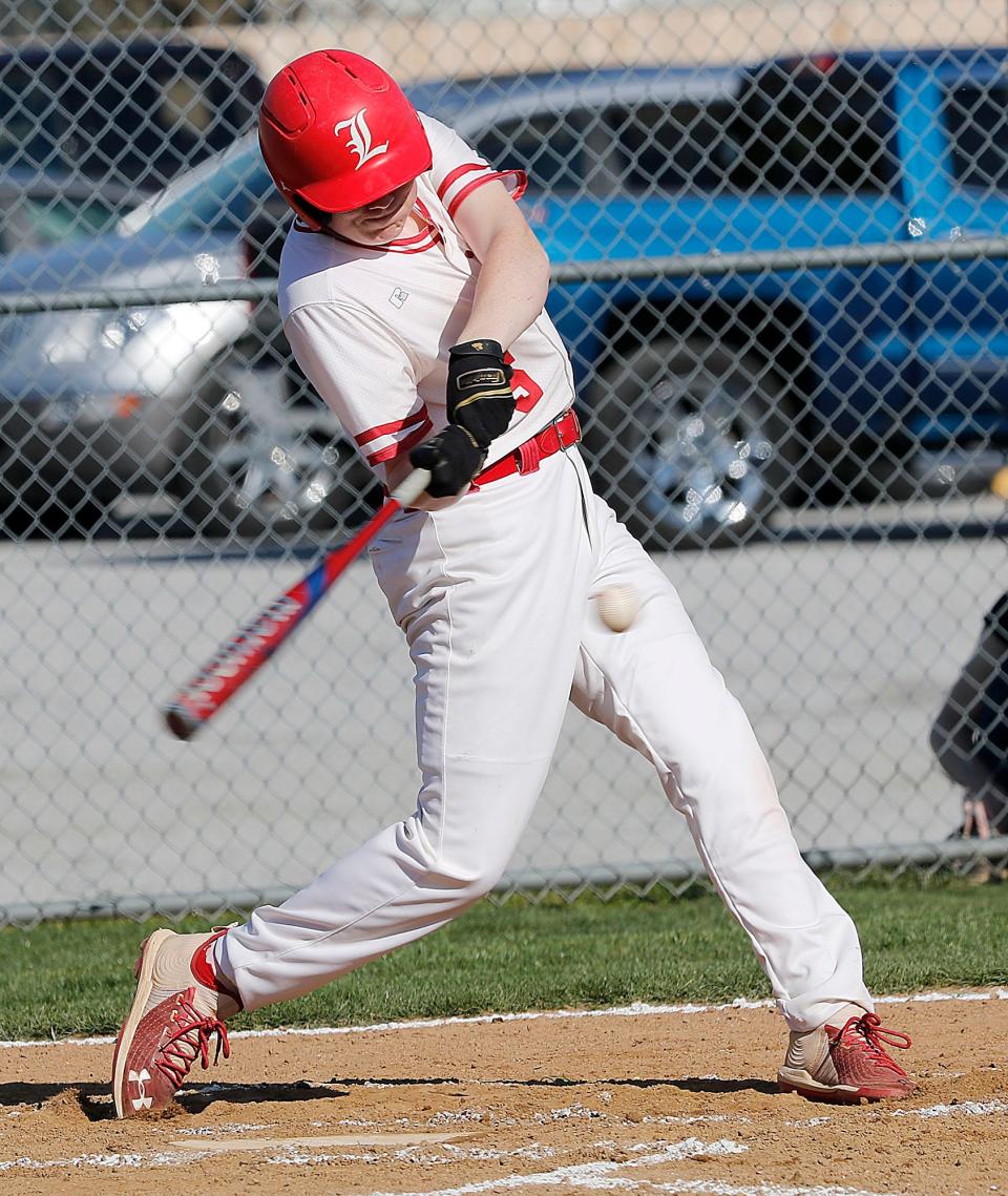 Loudonville High School's Judah Layton (15) connects with a pitch against Mansfield Christian High School during high school baseball action Monday, April 10, 2023 at Loudonville High School. TOM E. PUSKAR/ASHLAND TIMES-GAZETTE