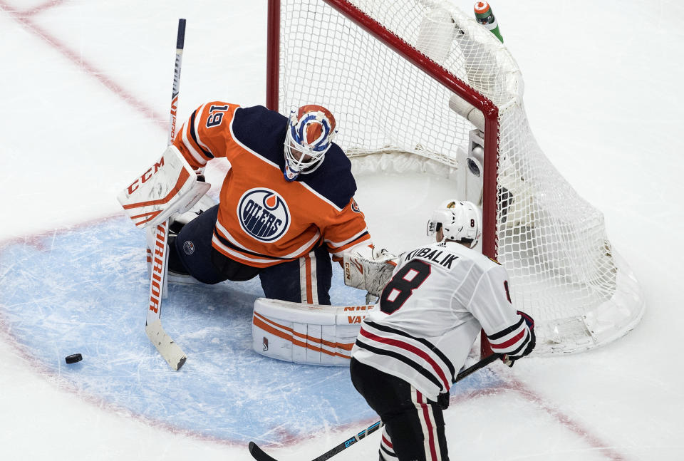 Edmonton Oilers goalie Mikko Koskinen (19) makes a save against Chicago Blackhawks' Dominik Kubalik (8) during third-period NHL hockey Stanley Cup playoff game action in Edmonton, Alberta, Saturday, Aug. 1, 2020. (Jason Franson/The Canadian Press via AP)