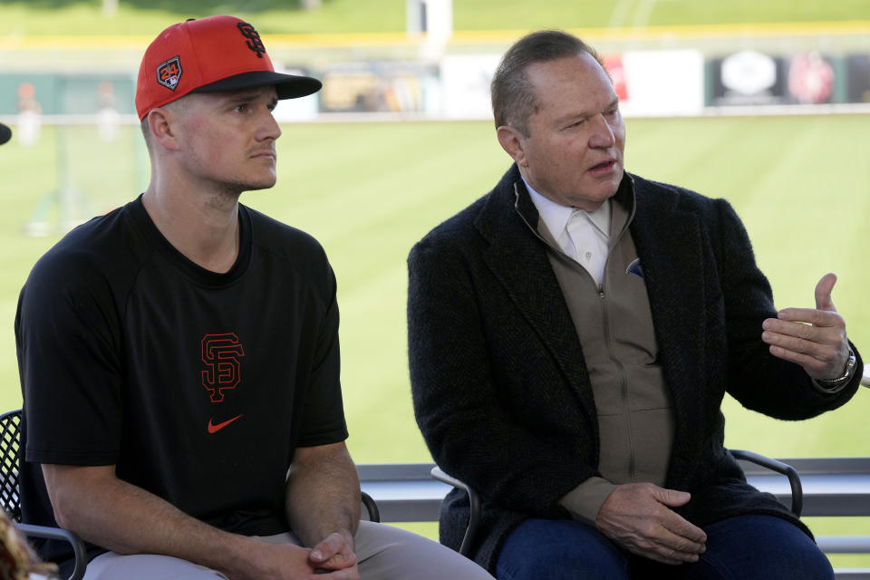 Scott Boras, right, agent to new San Francisco Giants infielder Matt Chapman, left, answers a question at a baseball news conference announcing his signing Monday, March 4, 2024, in Scottsdale, Ariz. (AP Photo/Ross D. Franklin)