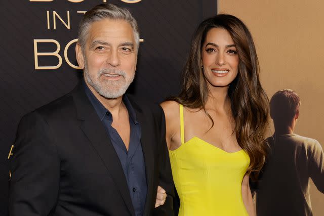 <p>Kevin Winter/Getty</p> George and Amal Clooney attend "The Boys in the Boat" Los Angeles premiere on Dec. 11
