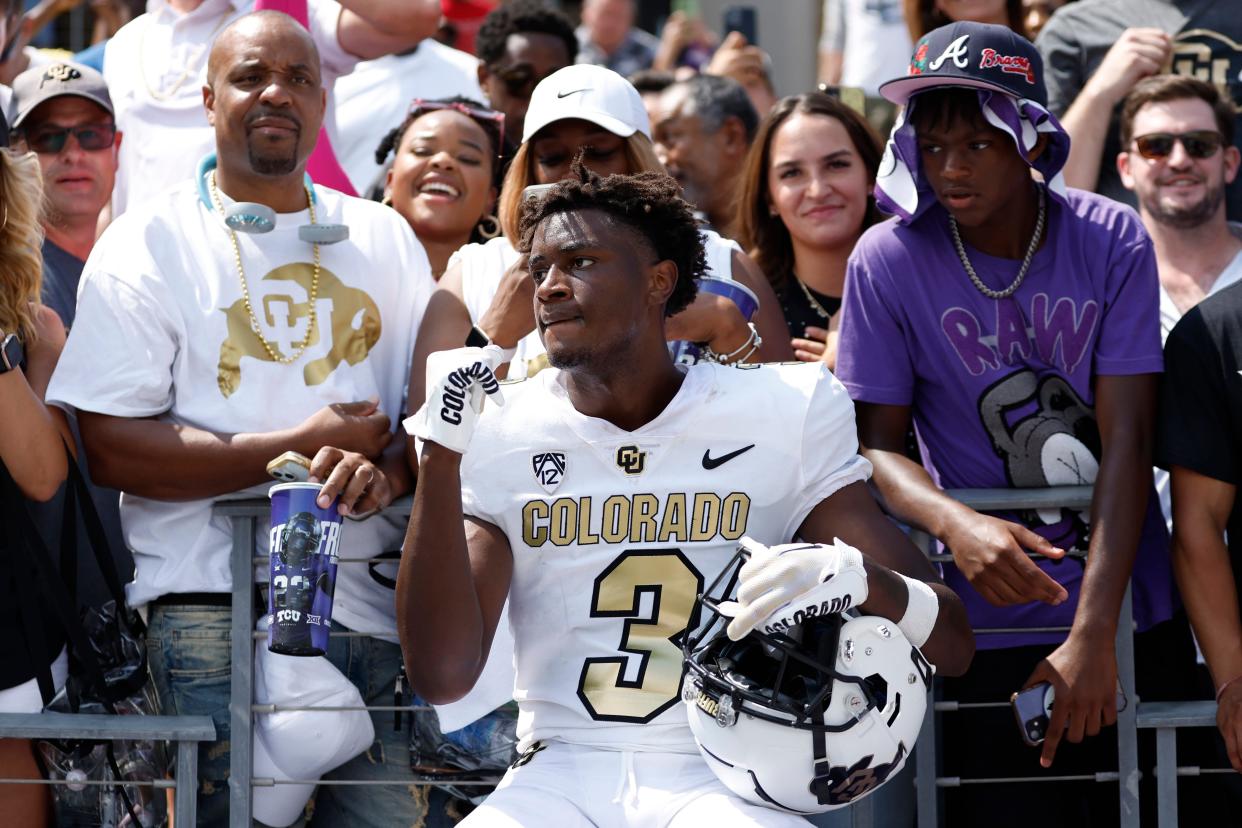 Former Colorado running back Dylan Edwards (3) celebrates with fans after the Buffaloes' 2023 season-opening victory at TCU. On Sunday, Edwards committed to play for Kansas State this fall.