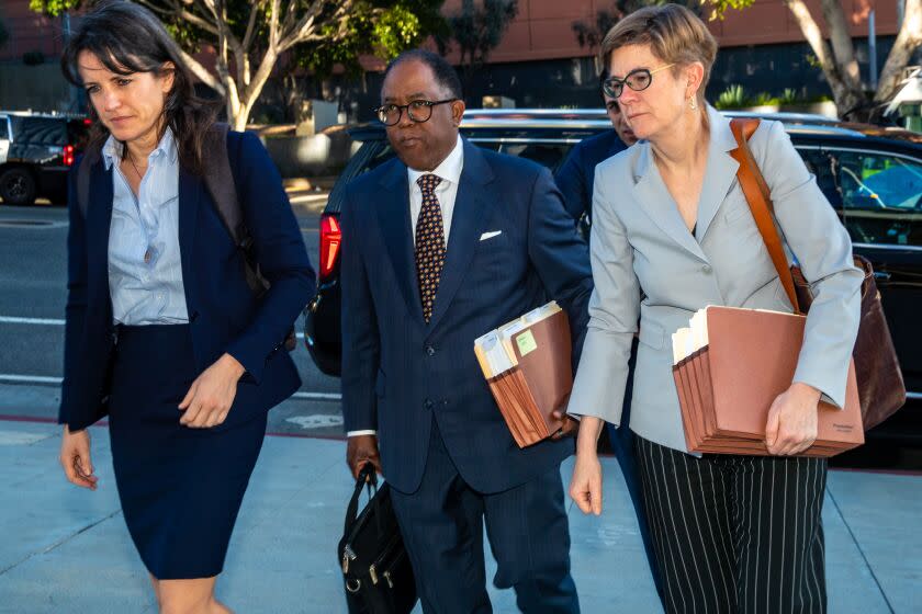 LOS ANGELES, CA - MARCH 09: Suspended Los Angeles City Councilman Mark Ridley-Thomas, center, who while a member of the Board of Supervisors allegedly steered county contracts to USC's social work school in exchange for benefits for his son, facing federal criminal case arrives with his team of attorneys at United States Courthouse on Thursday, March 9, 2023 in Los Angeles, CA. (Irfan Khan / Los Angeles Times)