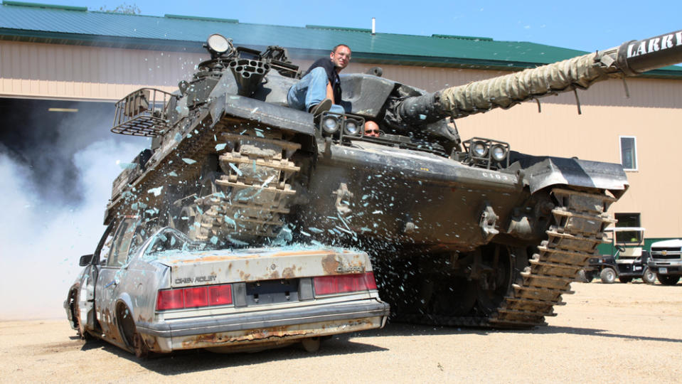 A Chieftain MK10 crushes an abandoned car at Drive a Tank in Kasota, Minn.