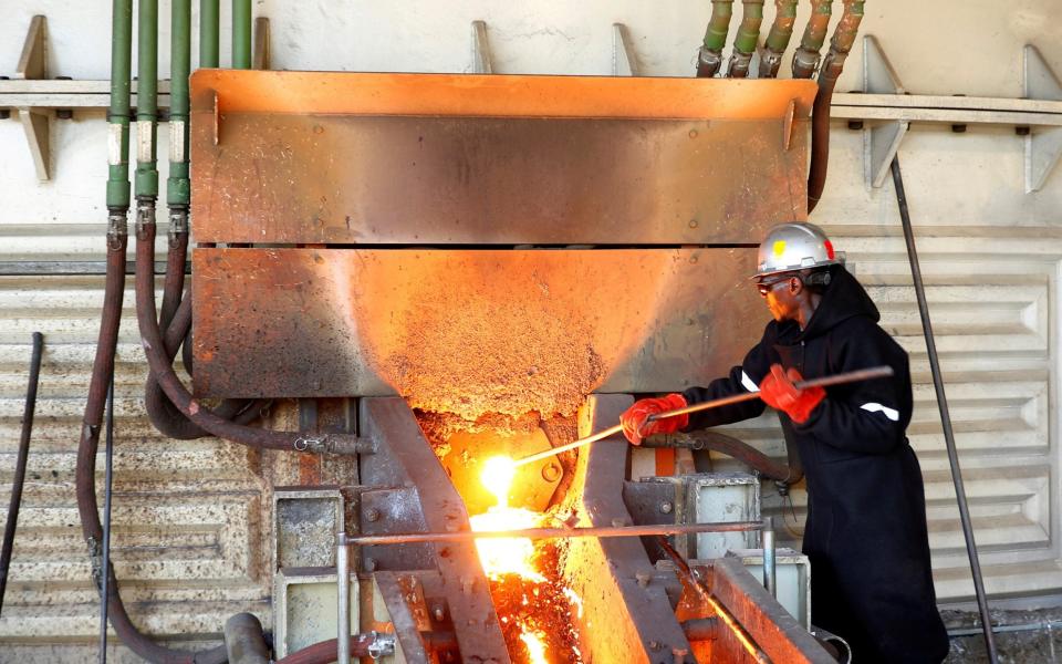 A worker attends to machinery at a smelter plant at Anglo American Platinum's Unki mine in Shurugwi, Zimbabwe, 2019