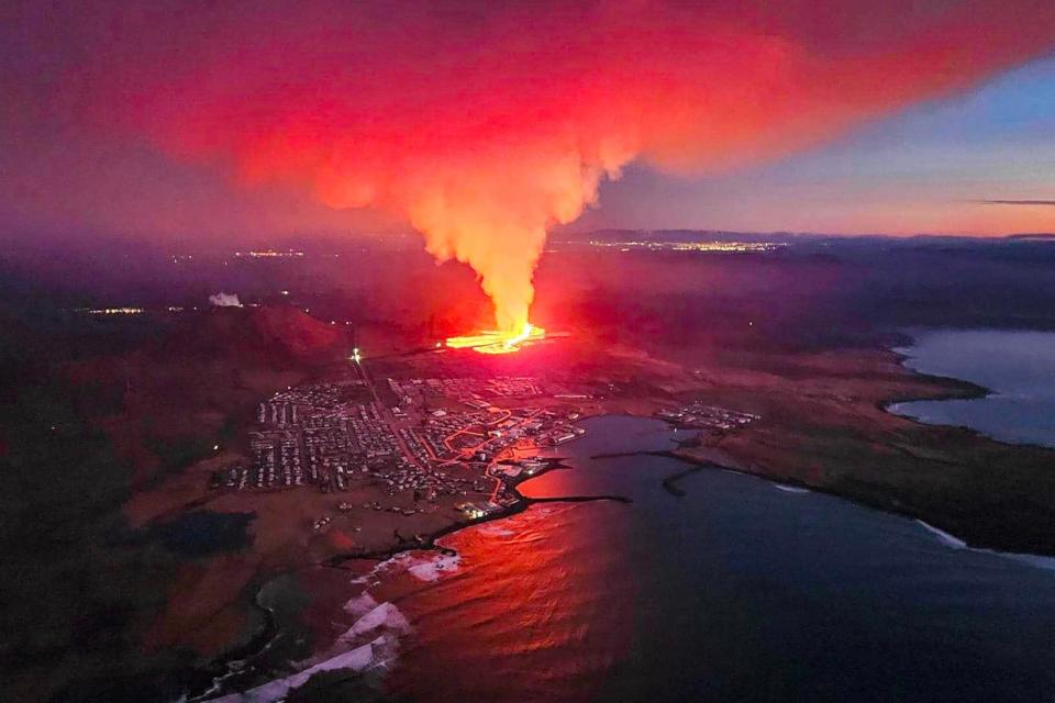 PHOTO: Billowing smoke and flowing lava are seen in this Icelandic Department of Civil Protection and Emergency Management , January 14, 2024, handout image during an volcanic eruption on the outskirts of the evacuated town of Grindavik, western Iceland.  (Icelandic Department Of Civil Protection/AFP via Getty Images)