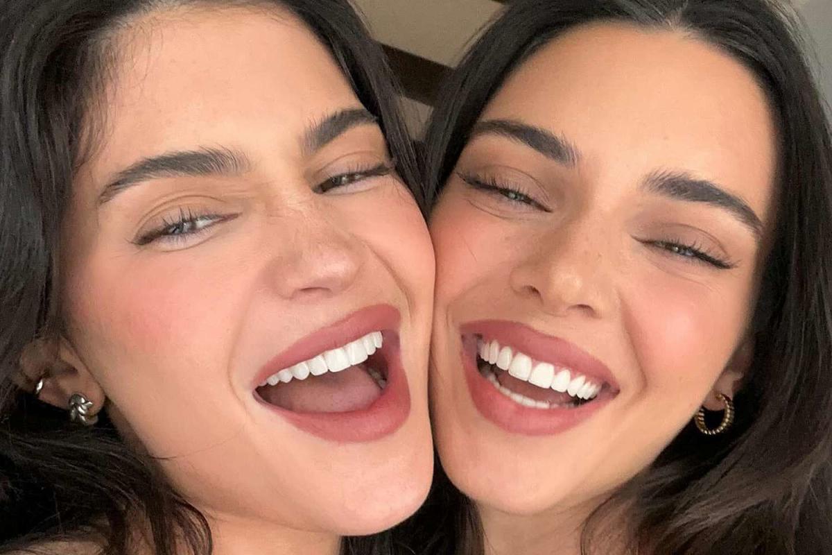Kendall and Kylie Jenner show off their tiny waists in red