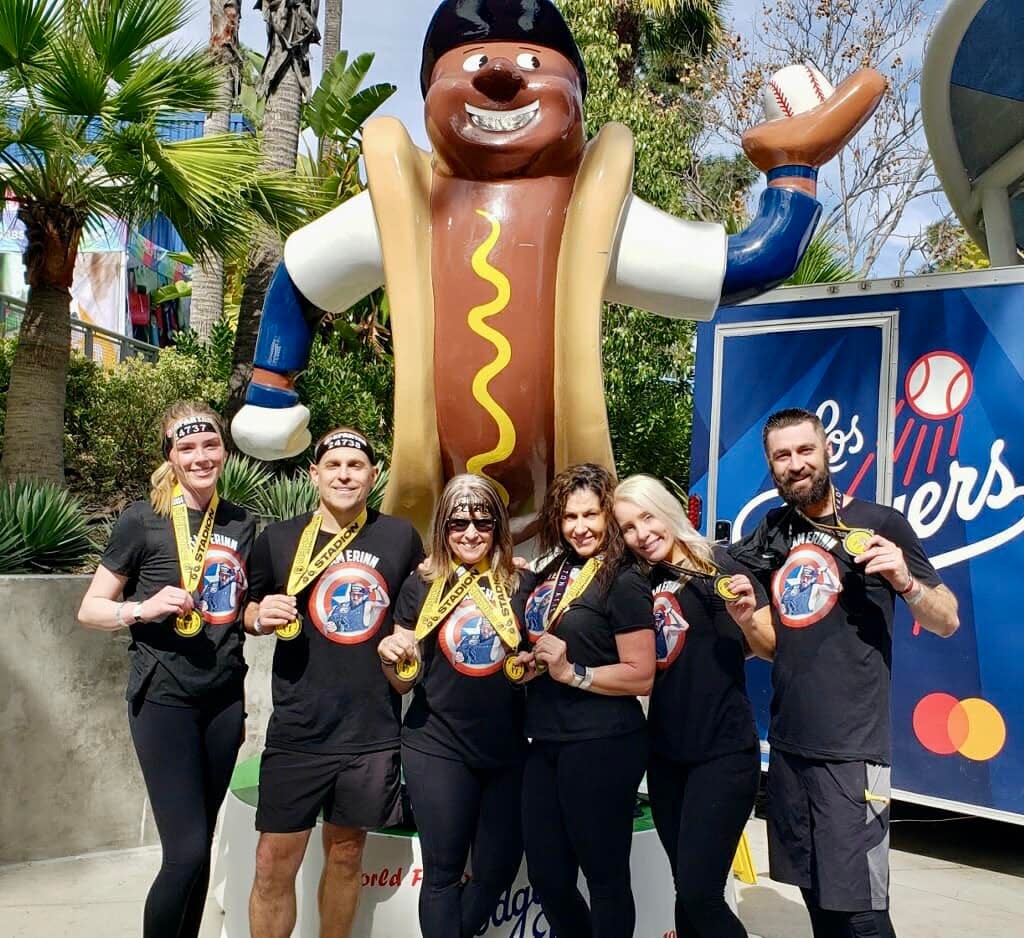 Clad in “Team Erinn” T-shirts, Debbie McGee, holding two medals, and her group went full beast mode as they took on the 5K, 20-obstacle Spartan Race inside Dodger Stadium in memory of her late son.