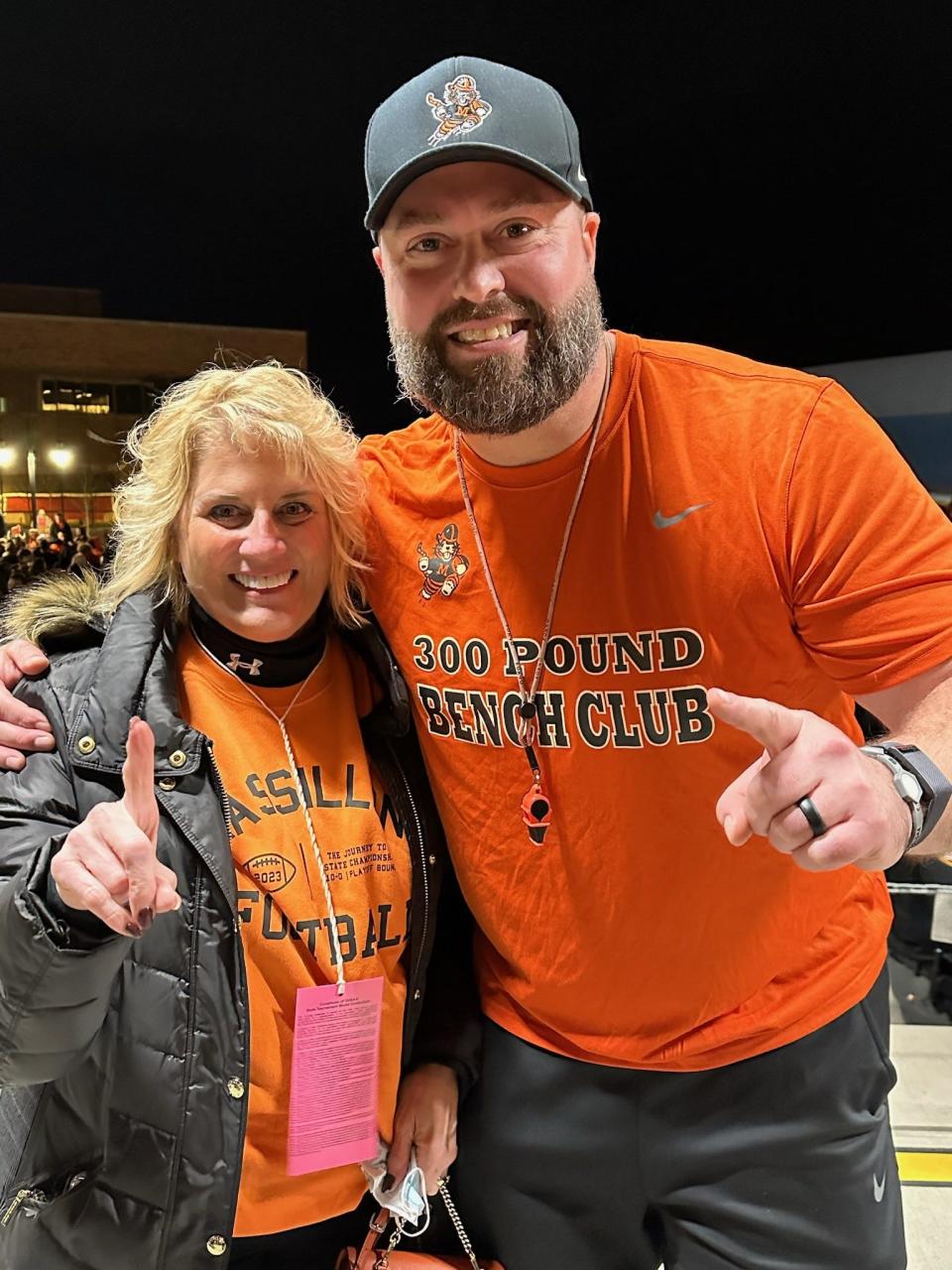 Massillon Mayor Kathy Catazaro-Perry and Tigers' football coach Nate Moore celebrate the team's Ohio Division II championship after its 7-2 victory Nov. 30 over Archbishop Hoban.