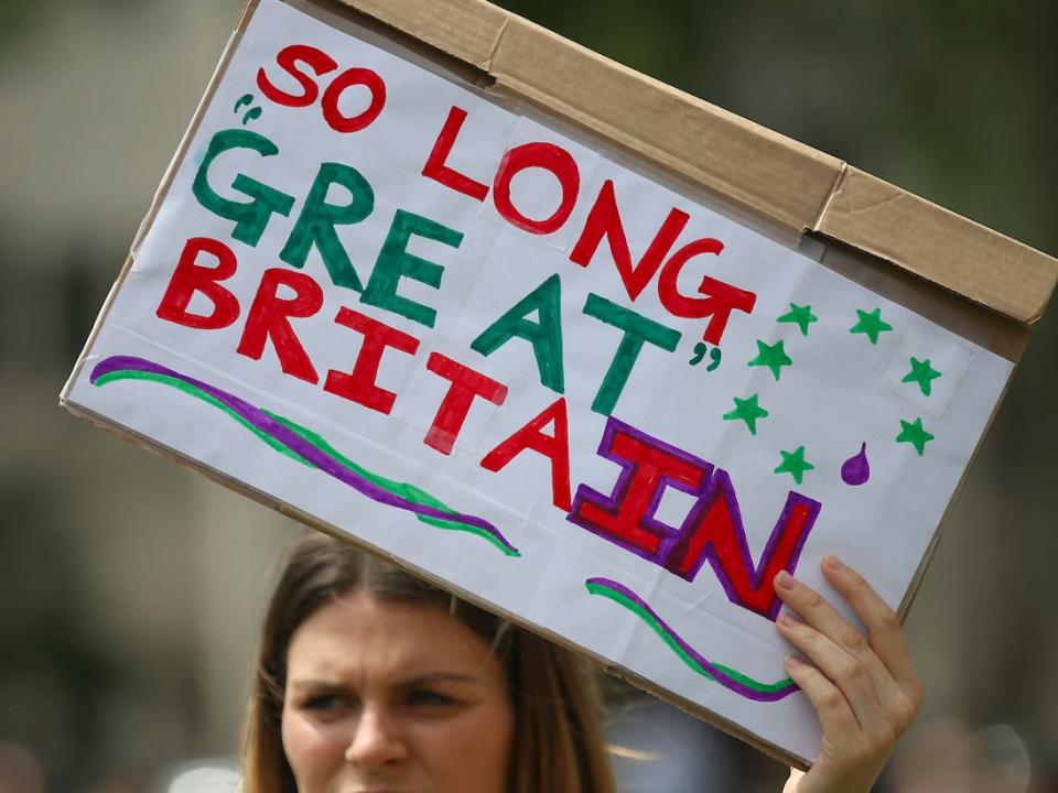 Demonstrators opposing Britain's exit from the European Union in Parliament Square following yesterday's EU referendum result hold a protest in London, Saturday, June 25, 2016. Britain voted to leave the European Union after a bitterly divisive referendum campaign. (AP Photo/Tim Ireland)