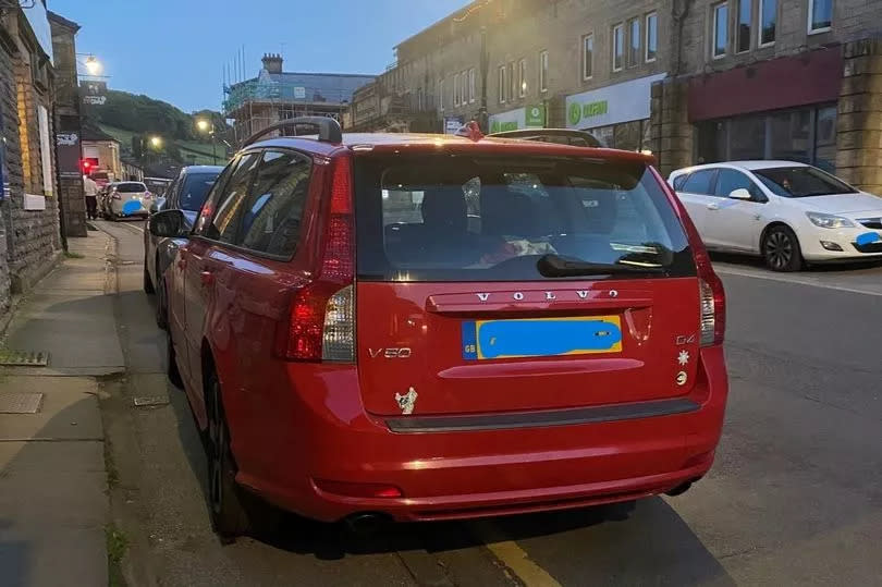 Car parked on the pavement in Holmfirth. Drivers are being fined by police for causing an obstruction -Credit:West Yorkshire Police