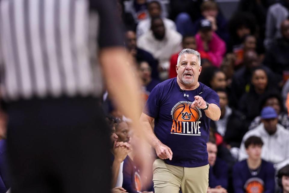 Auburn head coach Bruce Pearl points at the referee after a foul call during Saturday’s game against Kentucky.