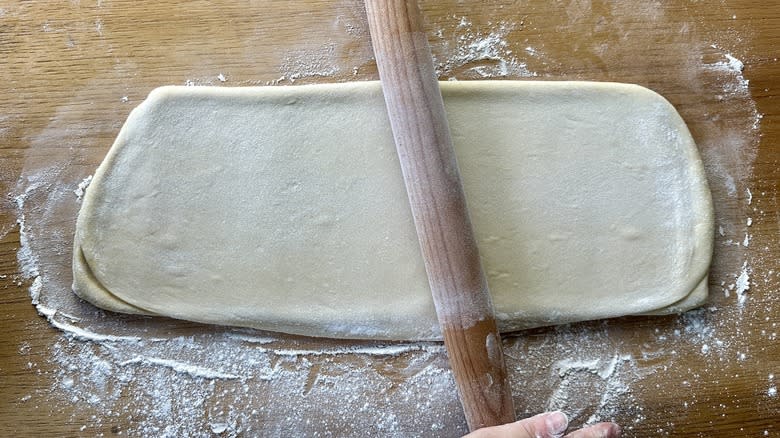 rolling dough on floured surface