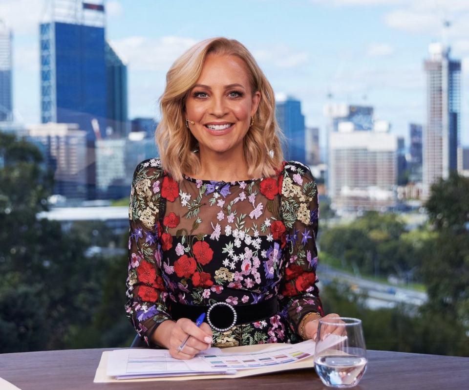 Carrie Bickmore behind The Project desk. 