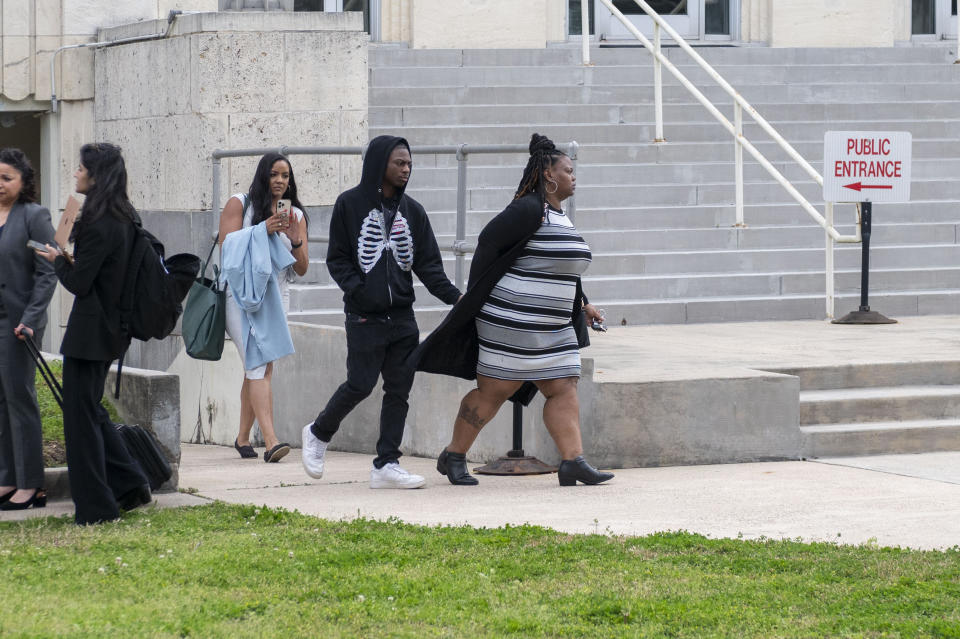 Darryl George, and his mother Darresha leave the courthouse after an unfavorable verdict regarding George's punishment for violating school dress code policy because of his hair style, Thursday Feb. 22, 2024 at the Chambers County Courthouse in Anahuac, Texas. A judge has ruled that George's monthslong punishment by his Texas school district for refusing to change his hairstyle does not violate a new state law prohibiting race-based hair discrimination. (Kirk Sides/Houston Chronicle via AP)