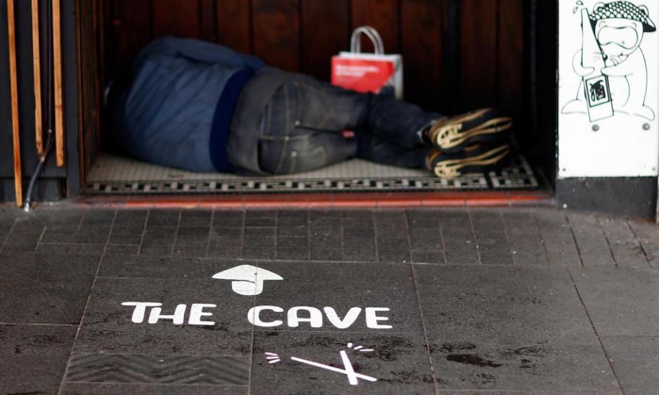 A homeless person sleeps in a doorway in the Auckland CBD.