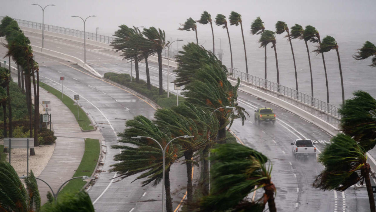 SARASOTA, FL - SEPTEMBER 28: Motorists travel across the John Ringling Causeway as Hurricane Ian churns to the south on September 28, 2022 in Sarasota, Florida. The storm made a U.S. landfall at Cayo Costa, Florida this afternoon as a Category 4 hurricane with wind speeds over 140 miles per hour in some areas.   Sean Rayford/Getty Images/AFP (Photo by Sean Rayford / GETTY IMAGES NORTH AMERICA / Getty Images via AFP)