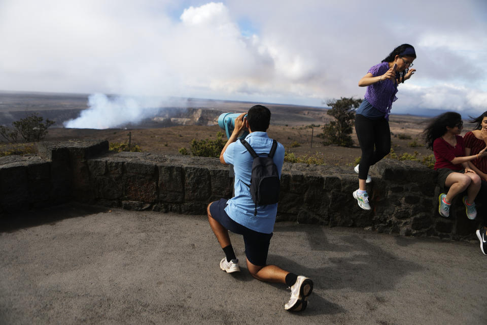 Visitors view the Halemaumau crater within the Kilauea volcano summit caldera at the re-opened Hawaii Volcanoes National Park on&nbsp;Monday.