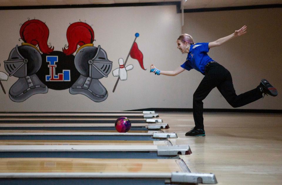 Lakewood senior Becca Price throws the ball down the lane as Lakewood hosted New Lexington in a bowling match up at Village Lanes in Thornville, Ohio on January 27, 2022.