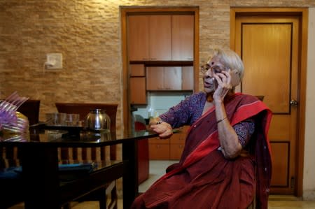 Nirmala Banerjee, mother of Abhijit Banerjee, one of the winners of 2019 Nobel Economics Prize, speaks on the phone at her house in Kolkata