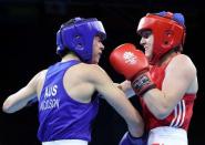 Boxing - Gold Coast 2018 Commonwealth Games - Women's 57kg Final Bout - Oxenford Studios - Gold Coast, Australia - April 14, 2018. Michaela Walsh of Northern Ireland in action with Skye Nicolson of Australia. REUTERS/Athit Perawongmetha