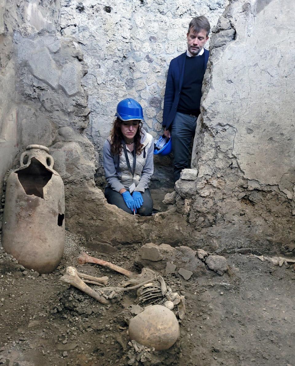 A picture made available Tuesday, May 16, 2023 by the Pompeii Archeological Park press office, showing one of the two discovered skeletons that archeologists believe were men who died when a wall collapsed on them during the powerful earthquakes that accompanied the eruption of Mount Vesuvius that destroyed the ancient city of Pompeii in 79 A.D.