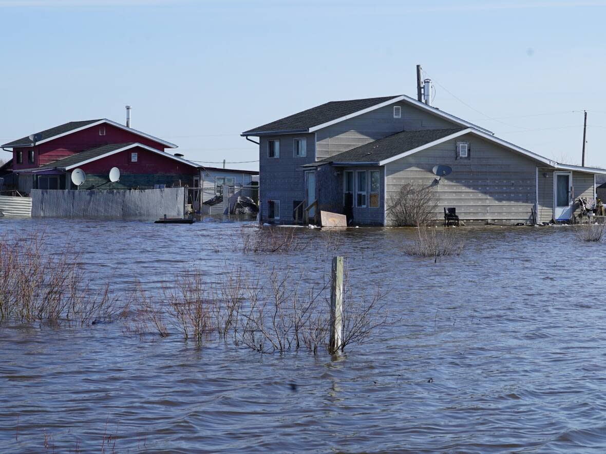 A house partially submerged in floodwater on the Peguis First Nation on May 6, 2022. David Carrière-Acco, president of Acosys Consulting Services, says the community was considered to be at a low flood risk last year under current federal flood mapping guidelines. (Jaison Empson/CBC - image credit)