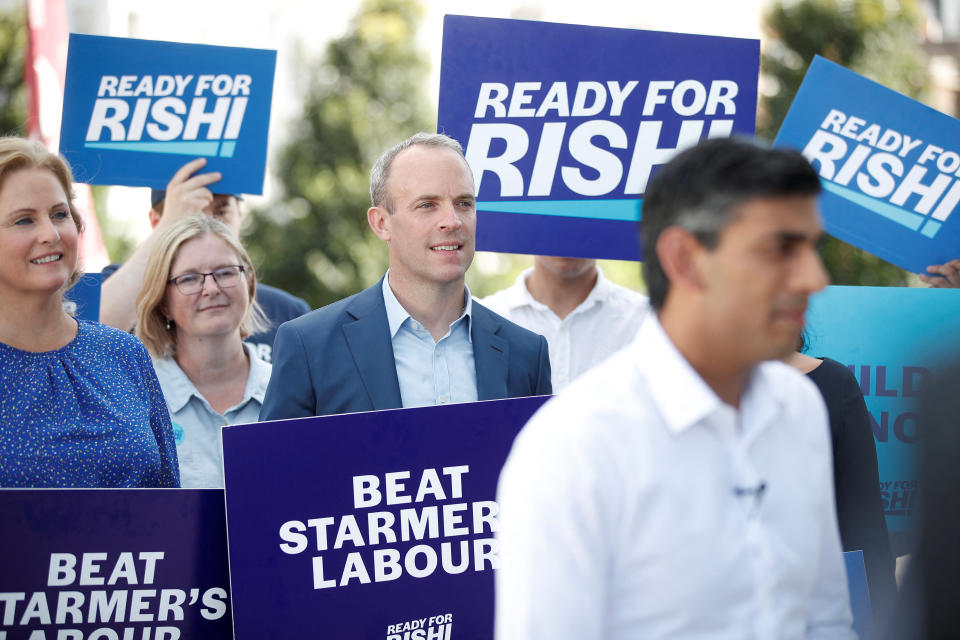 MP Dominic Raab listens as Conservative leadership candidate Rishi Sunak speaks during an event, part of the Conservative party leadership campaign, in Eastbourne, Britain, August 5, 2022. REUTERS/Peter Nicholls