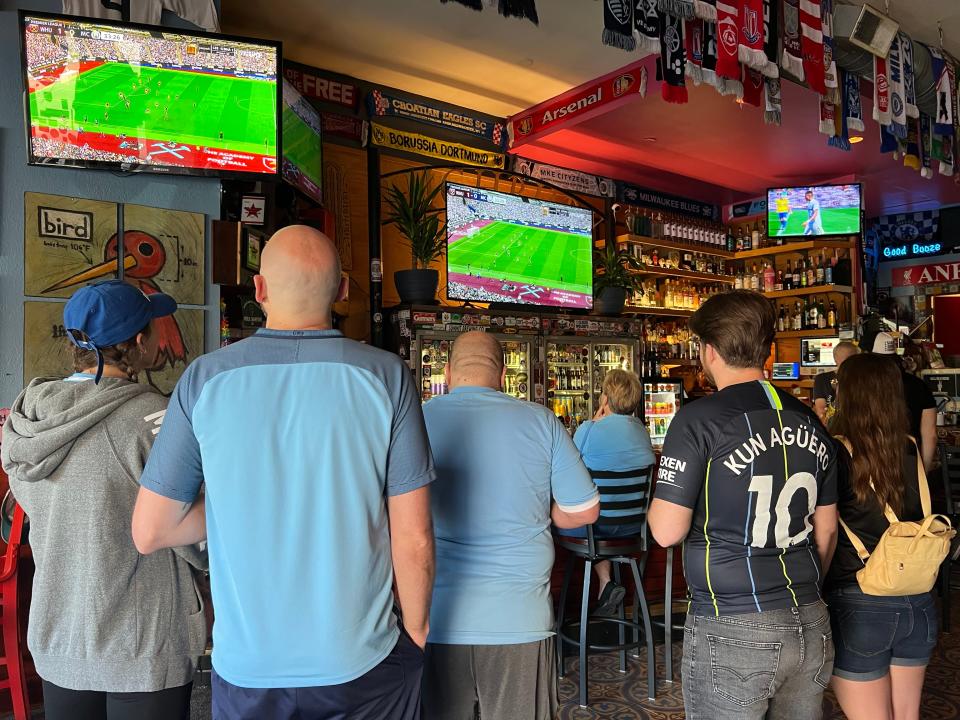 Manchester City fans watch a game at Highbury Pub.