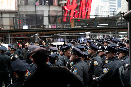 New York Police Department (NYPD) officers secure Times Square ahead of the New Year's Eve celebrations in Manhattan, New York, U.S., December 31, 2018. REUTERS/Jeenah Moon